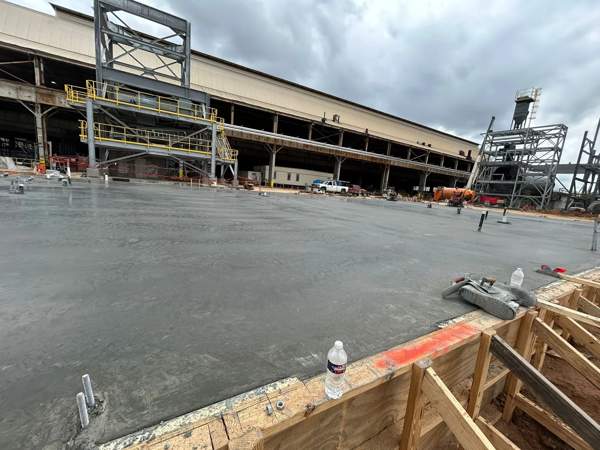 Concrete crew working on a large industrial slab.